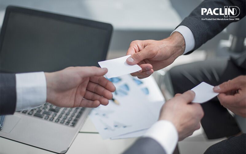 hands over exchanging business cards